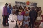 Professor Carl LeVan with students at the U.S. Embassy in Nigeria. Photo courtesy of Bill Strassberger.